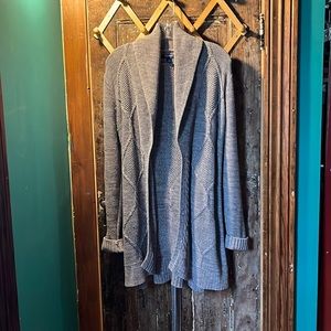 Knee length wrap around cable knit sweater